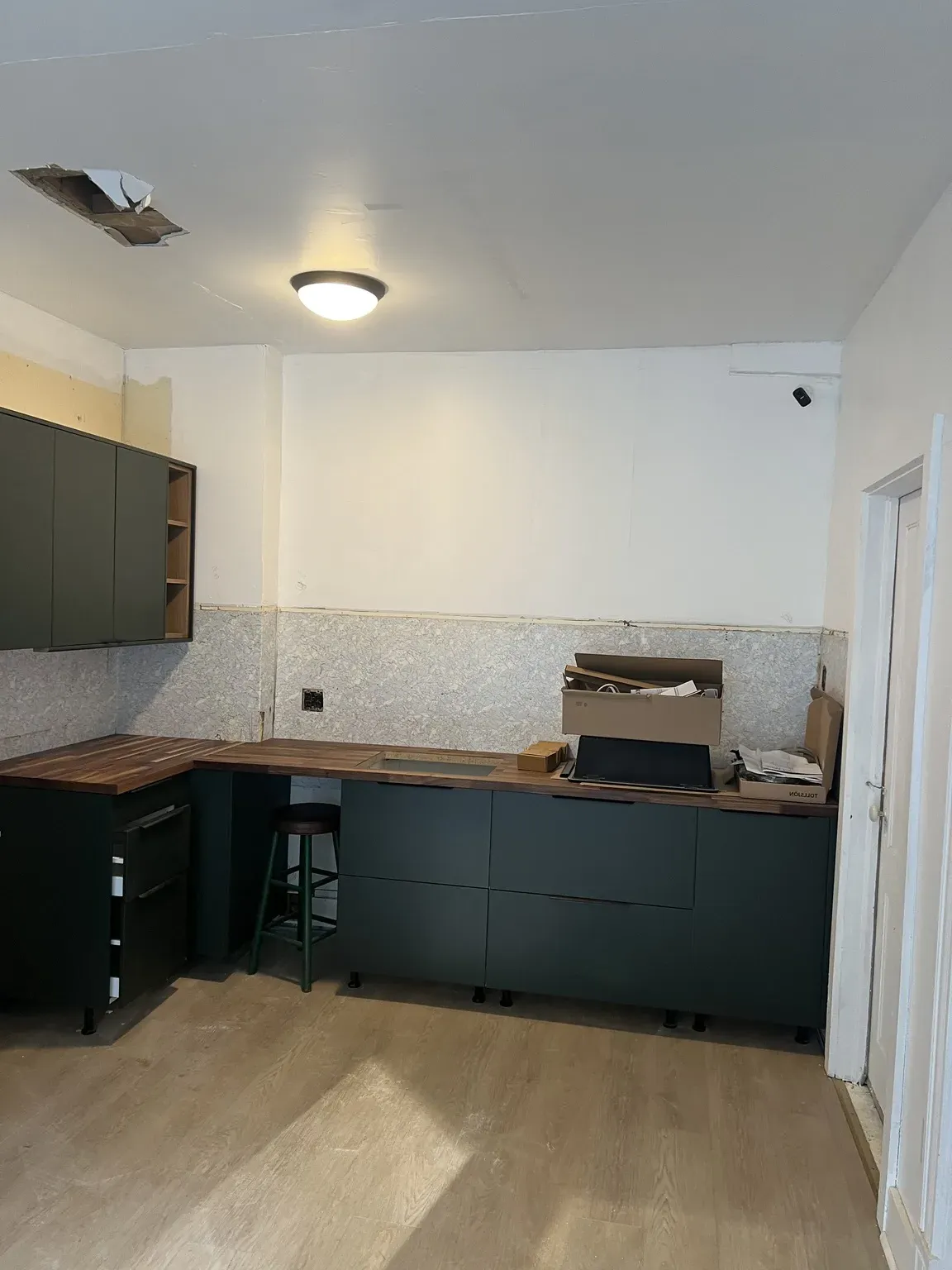 Dark Green Kitchen with Wood Accents