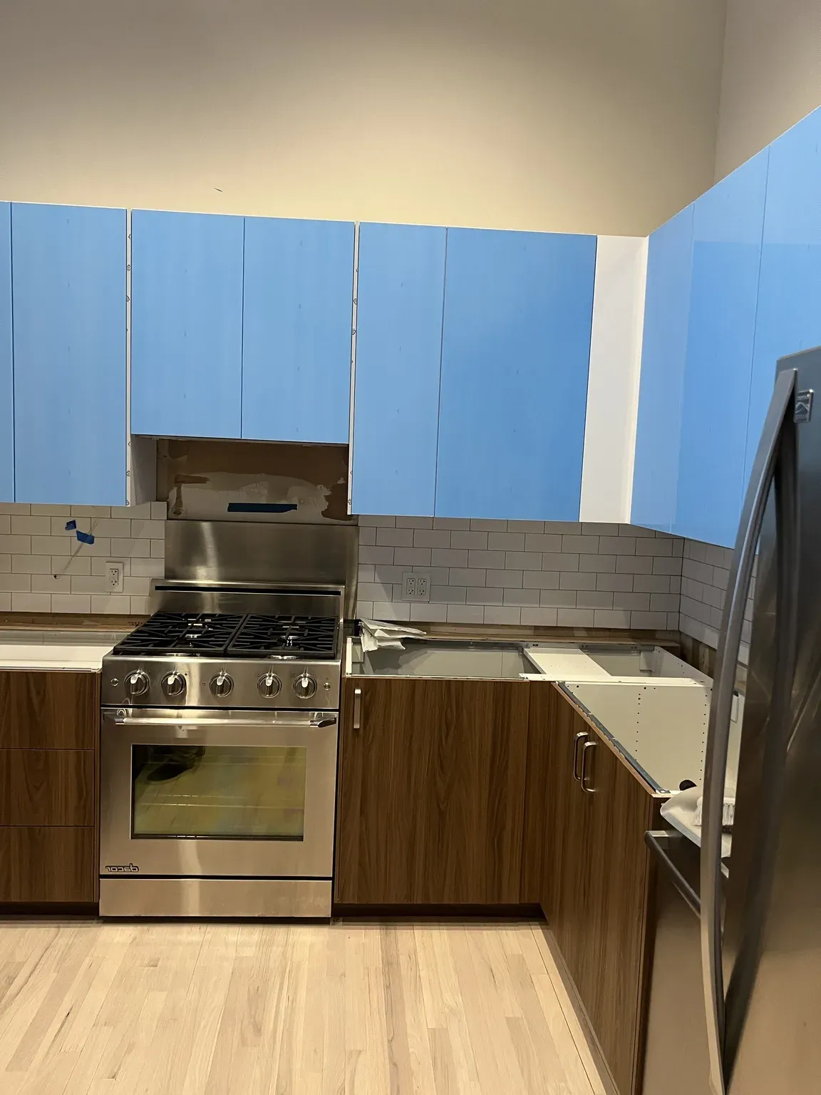 Walnut Cabinets with Blue Countertop